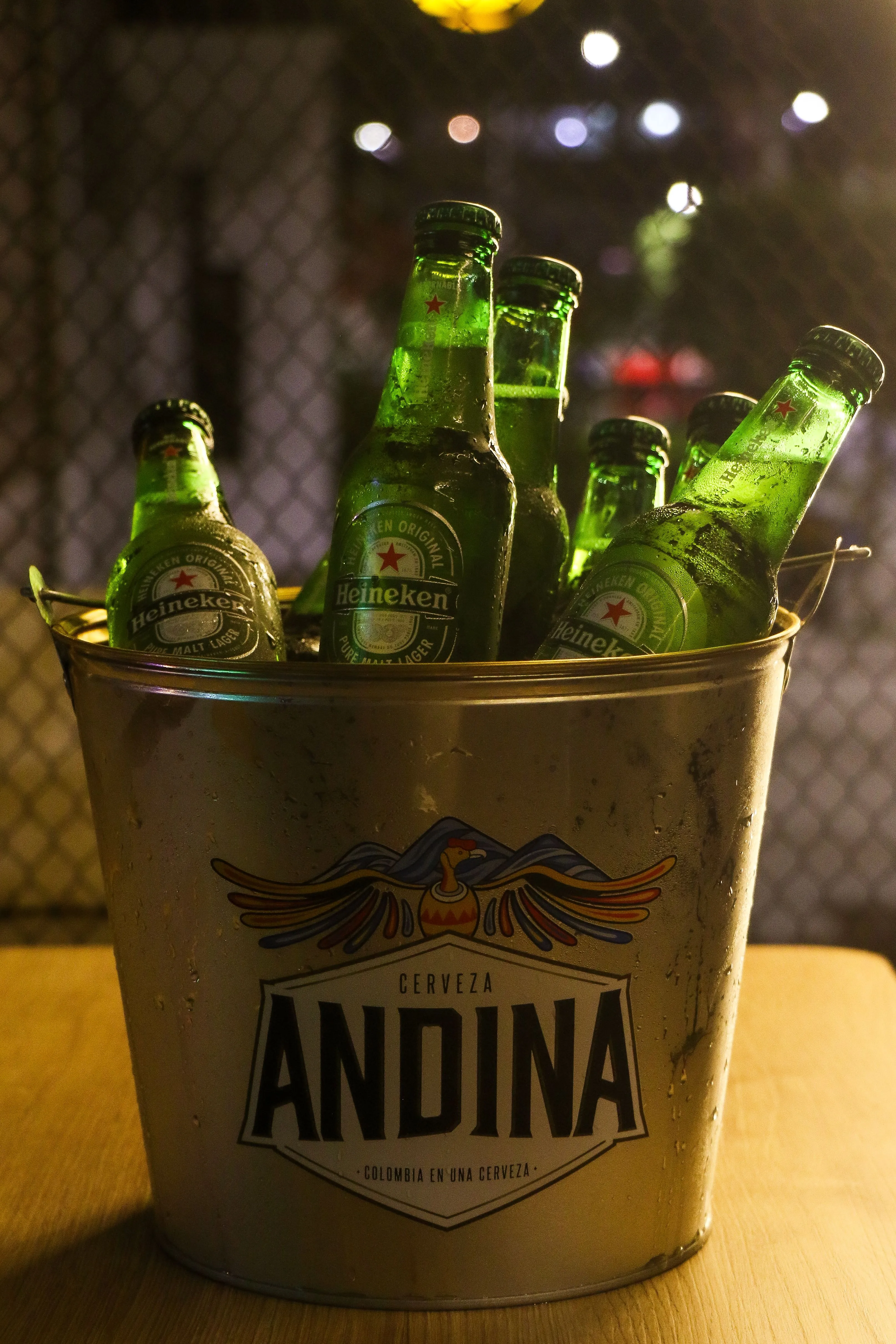 A bucket filled with ice and cold beers