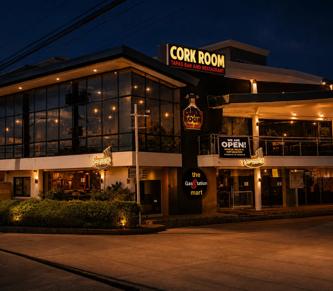 The glass-walled exterior of Cork Room on Dewey Avenue